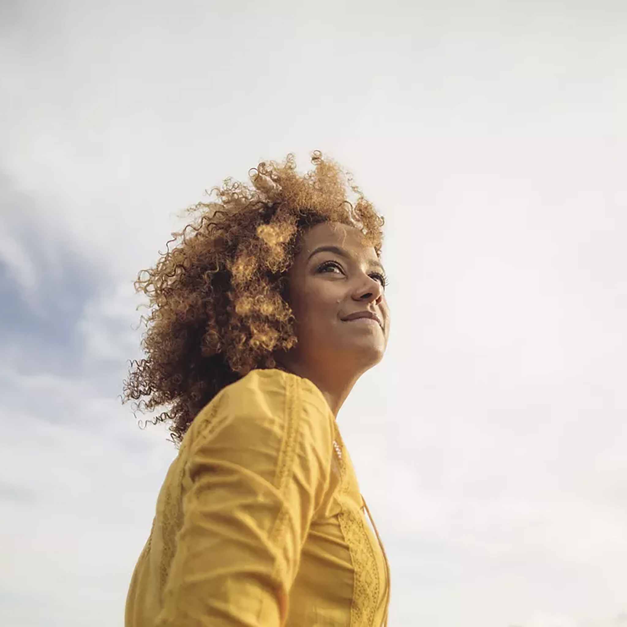 Woman smiling sky