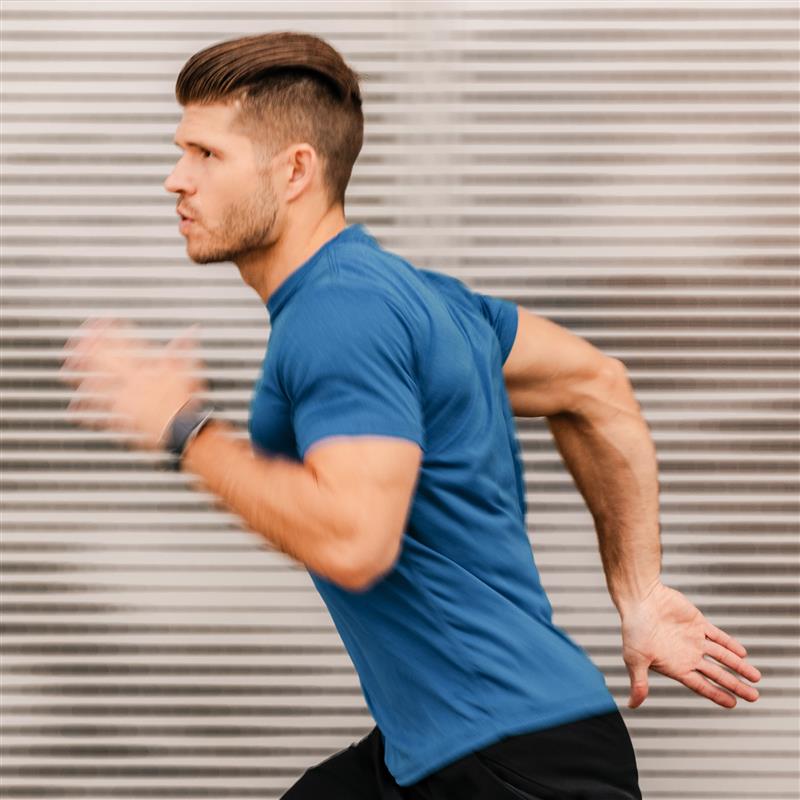 Man in blue sports shirt running