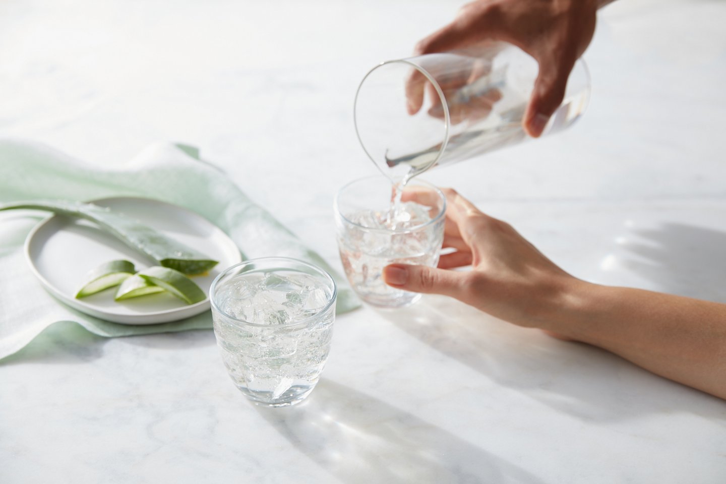 A cup of water with Aloe