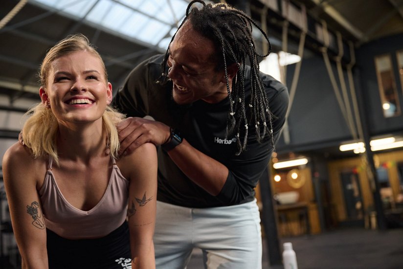 People relaxing and talking after group exercise