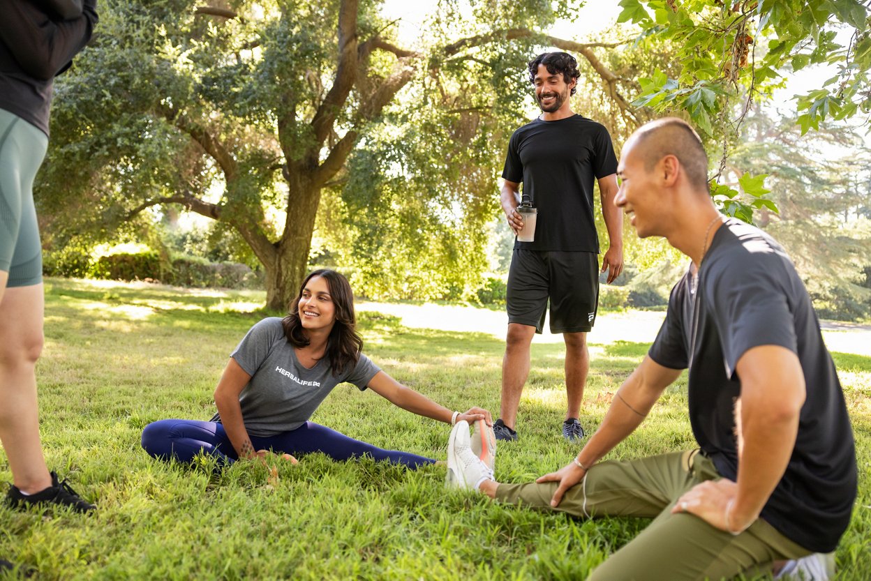 Group preparing for yoga workout outdoors.,Group preparing for yoga workout outdoors.
