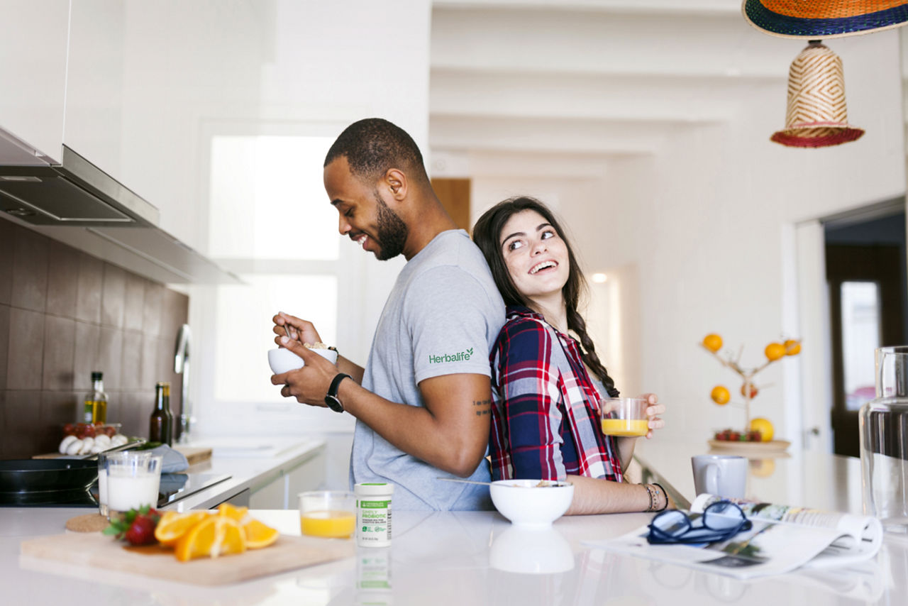 Couple in their kitchen enjoying a healthy breakfast