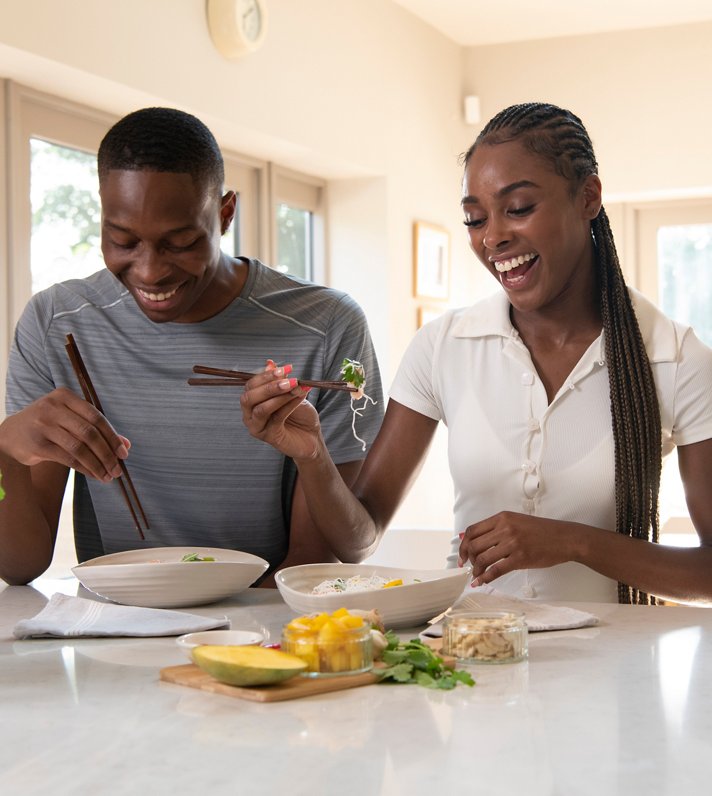 Couple enjoying lunch in their kitchen