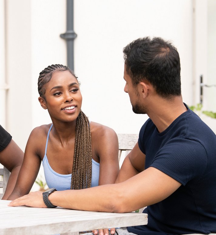 Friends having a conversation outdoors