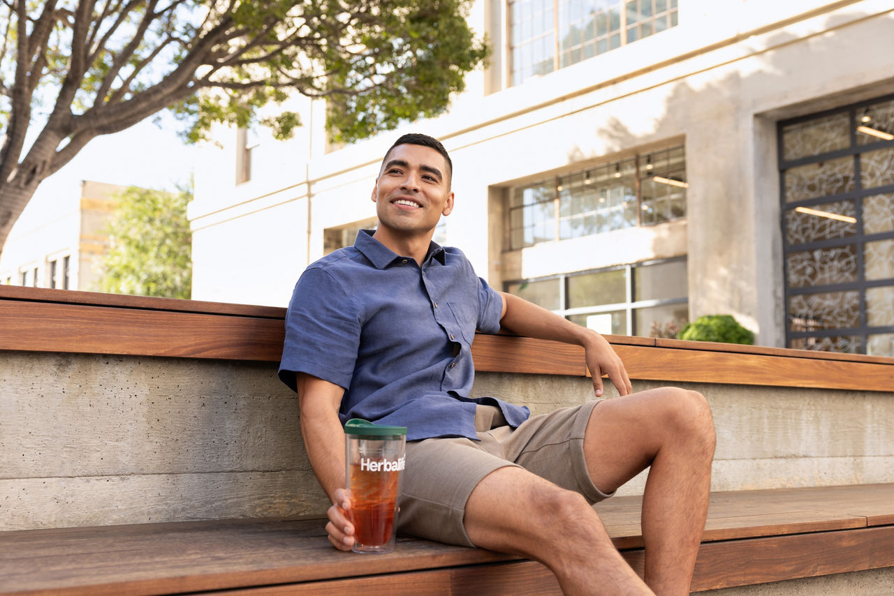 man holding tea