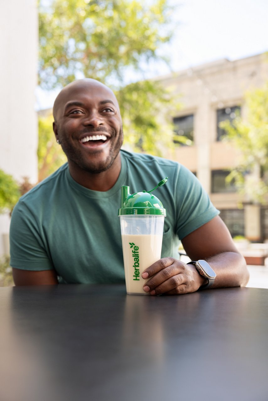 Man relaxing with Formula 1 Shake outdoors.