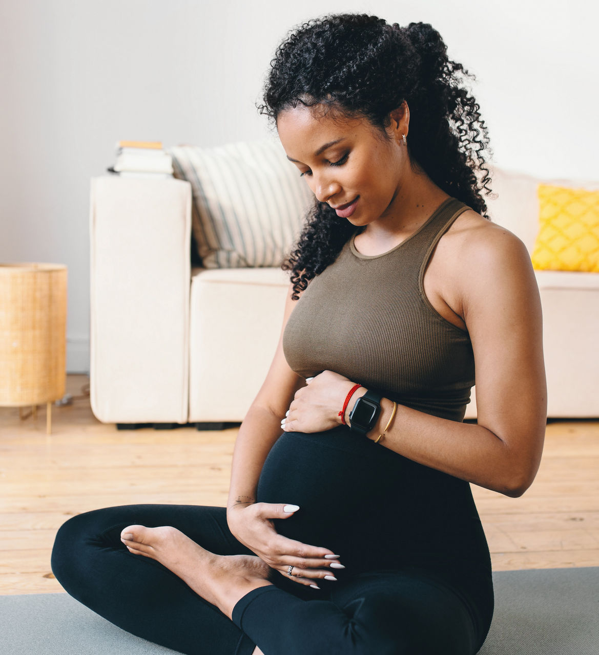 A pregnant woman relaxing at home