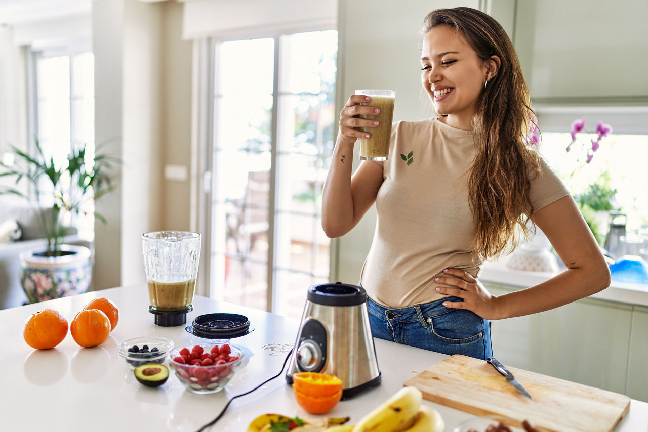 Woman making a vanilla protein shake