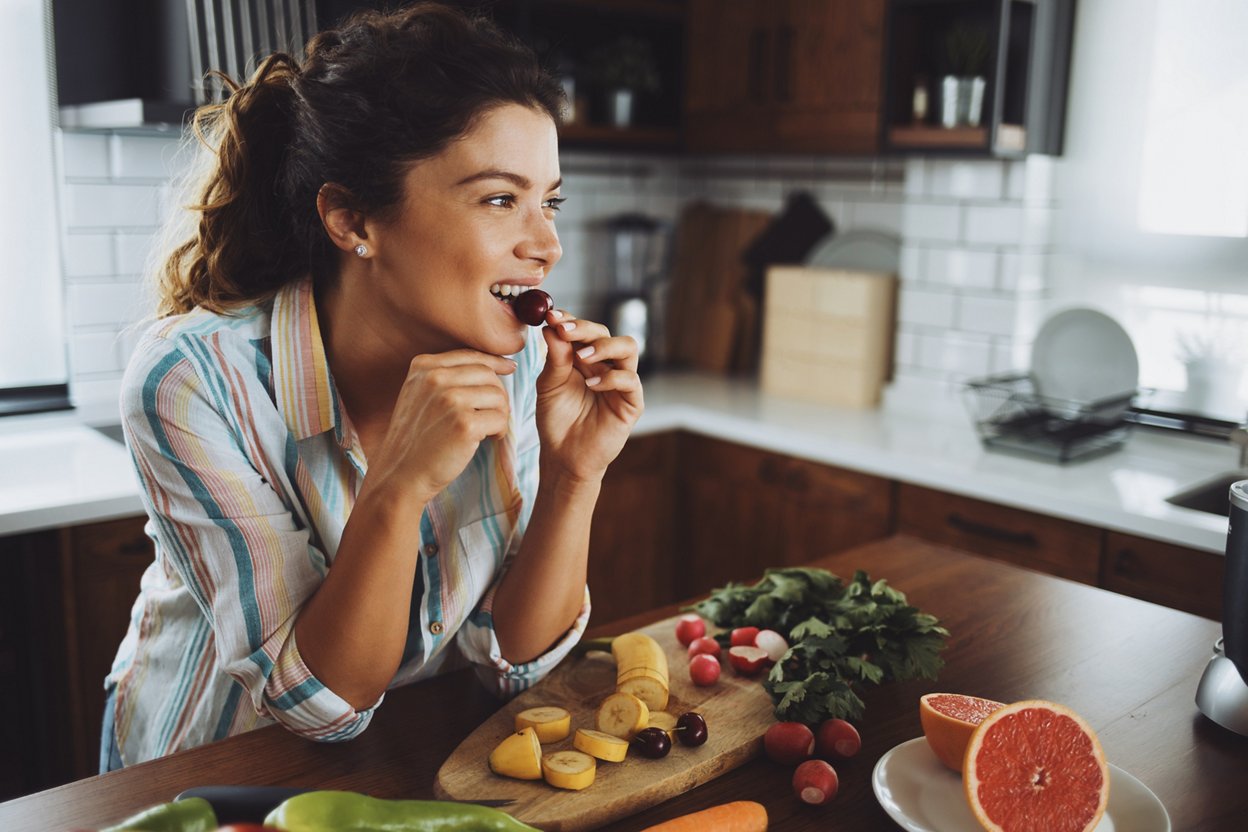 Woman eating cherry