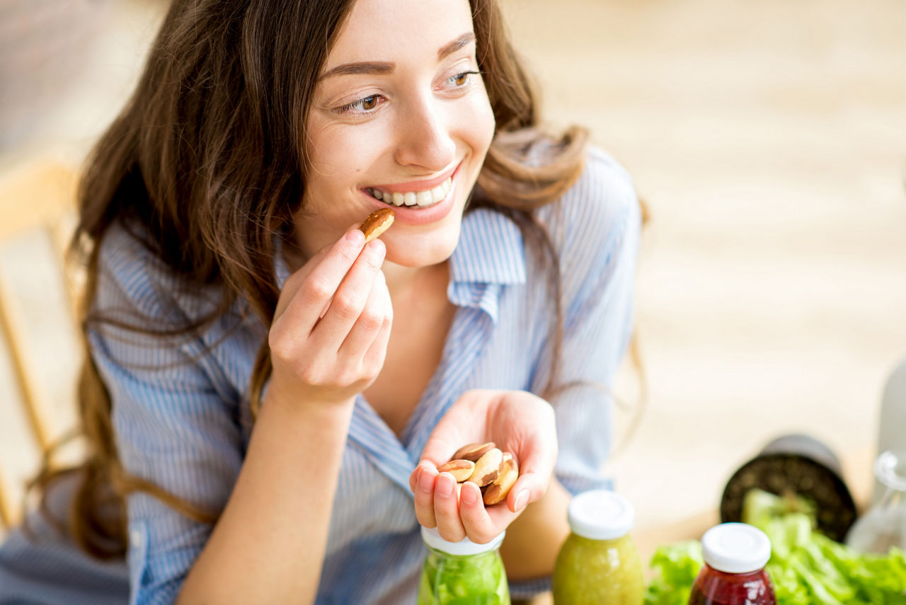 Woman snacking nuts