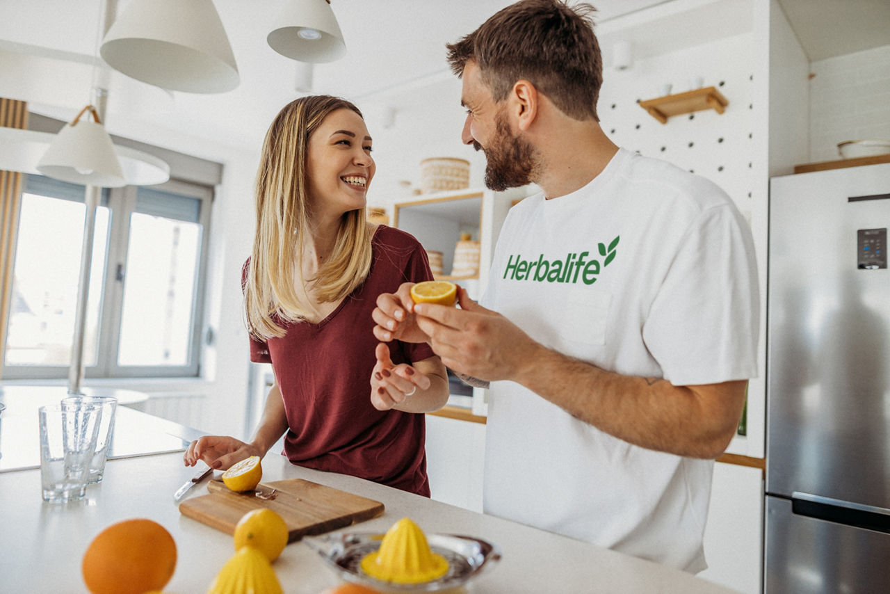 Young couple making juice