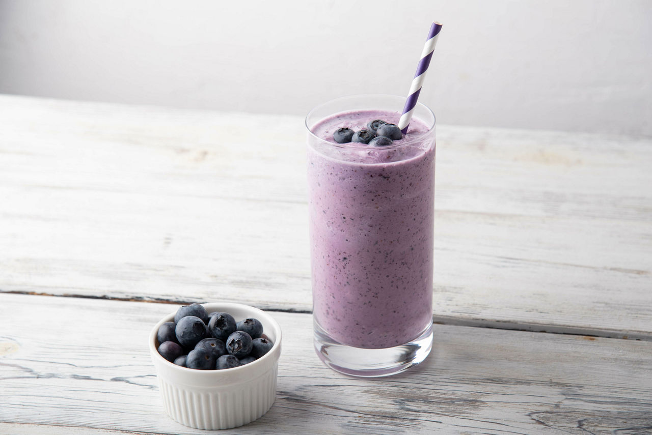 Blueberry smoothie on white background