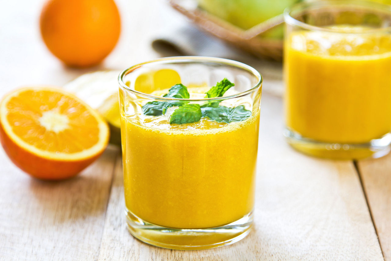 Orange smoothie with fresh ingredients 