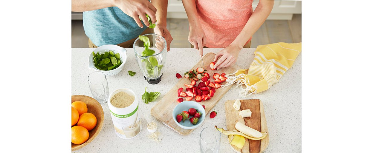 Global Lifestyle Shoot - Woman Cutting Strawberries