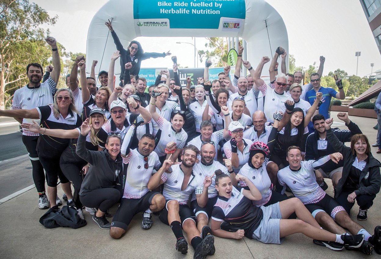 HNF Bike Ride 2020: Herbalife Members celebrating at the finish line