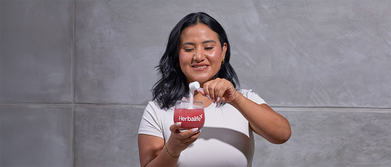 Woman preparing collagen drink