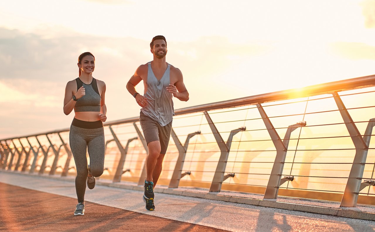 Couple doing sport together on the street. Morning run