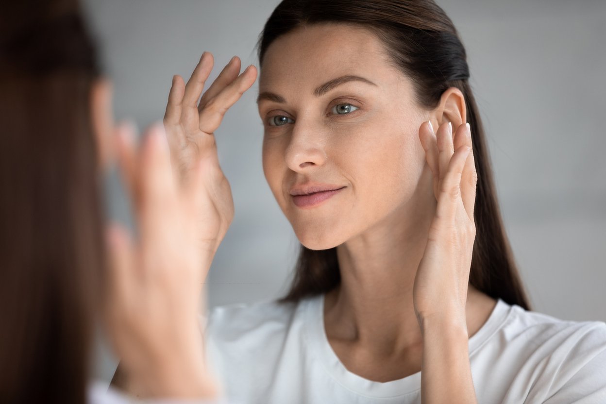 Woman applying eye cream