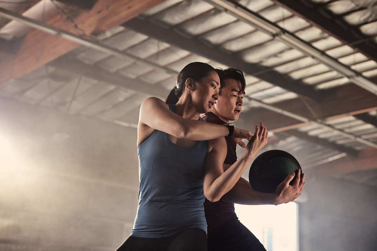 Couple with medicine ball twist