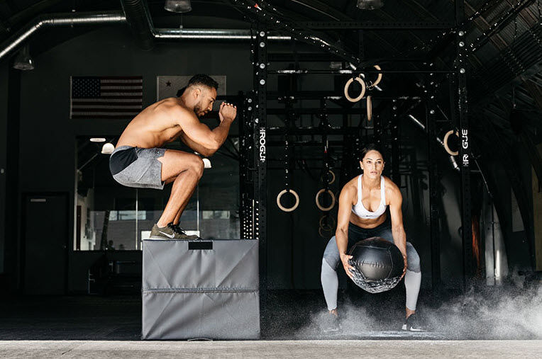 man and woman strenght training