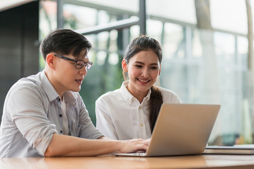 Couple viewing a web site on their laptop