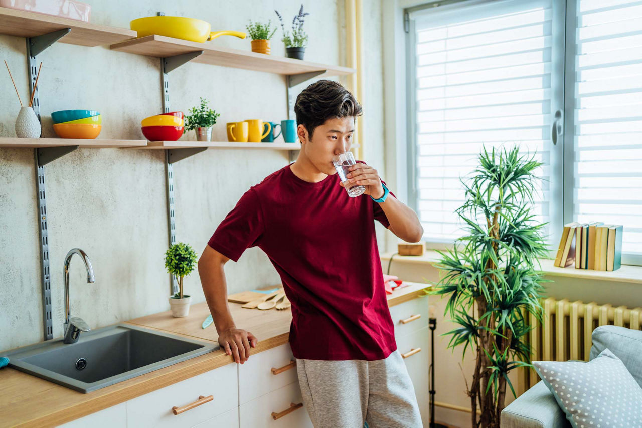 Man drinks water to stay hydrated