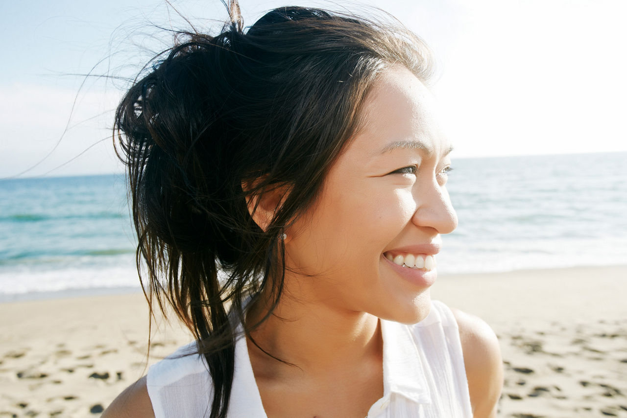 woman smiling on beach 