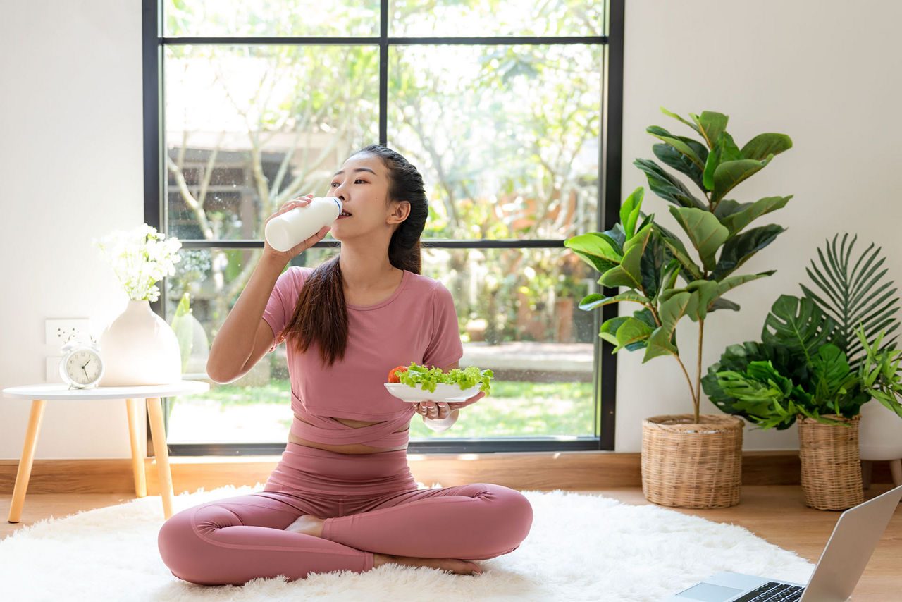 Woman eating salad