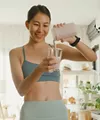 Woman making a protein shake