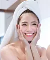 Woman smiling in the bathroom