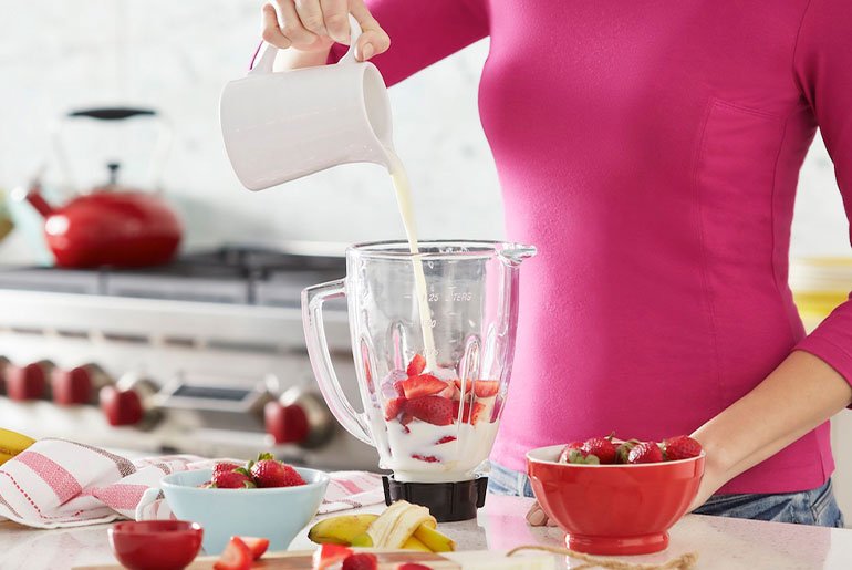 Woman making smoothie