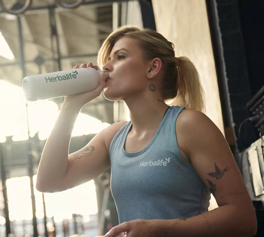 Woman Drinking Beverage Gym