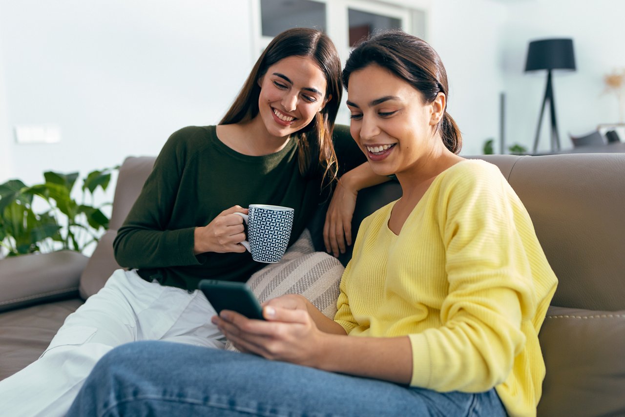 Two women looking at phone