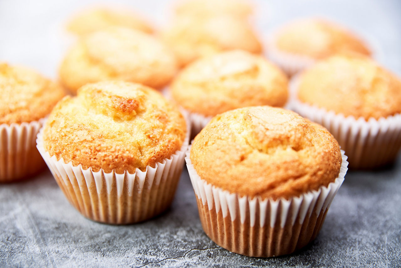 Top view of a group of delicious cupcakes. Concept of sweets.