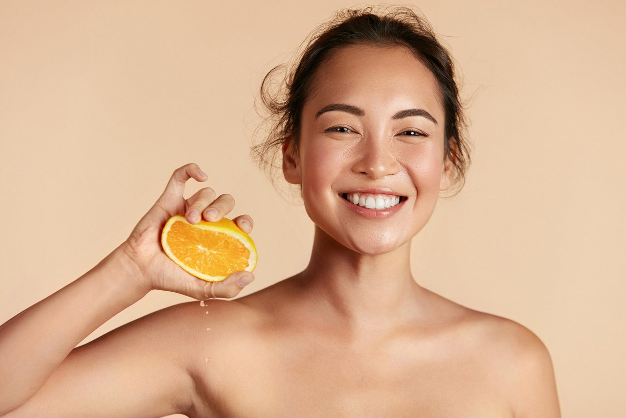 Woman holding an orange