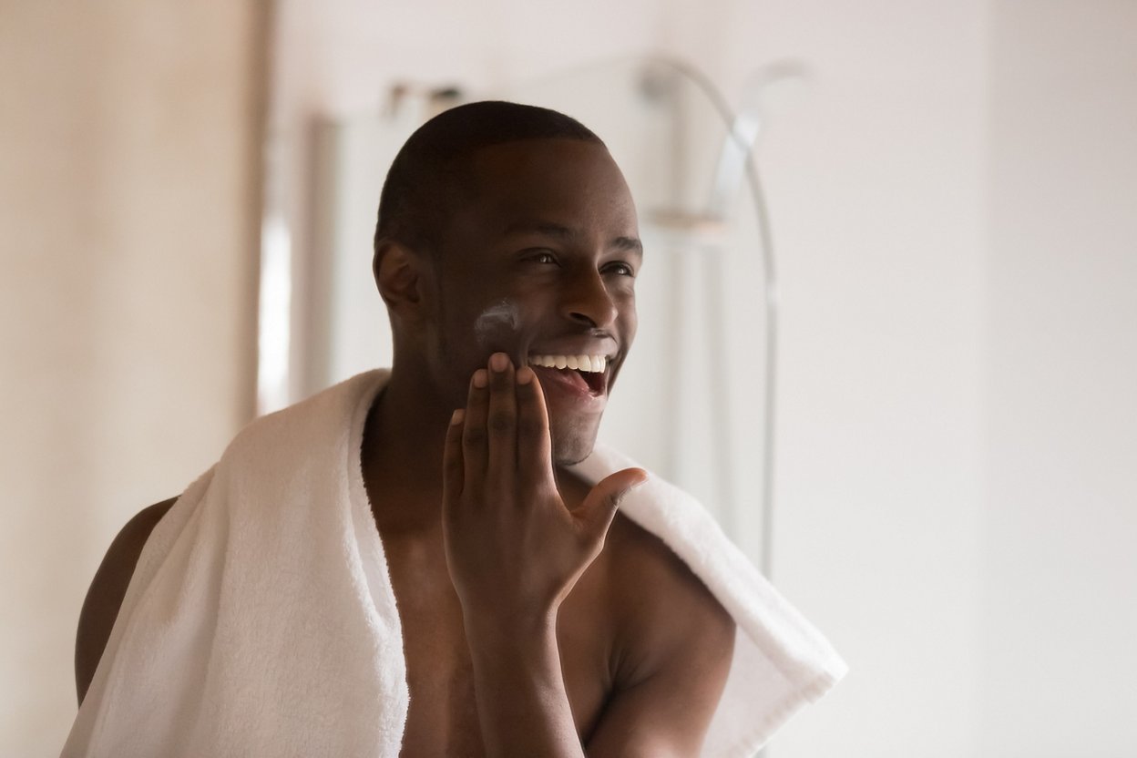 Man doing skin care in the morning