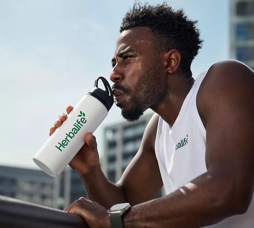 Man staying hydrated during run