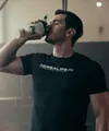 Man drinking protein shake after workout