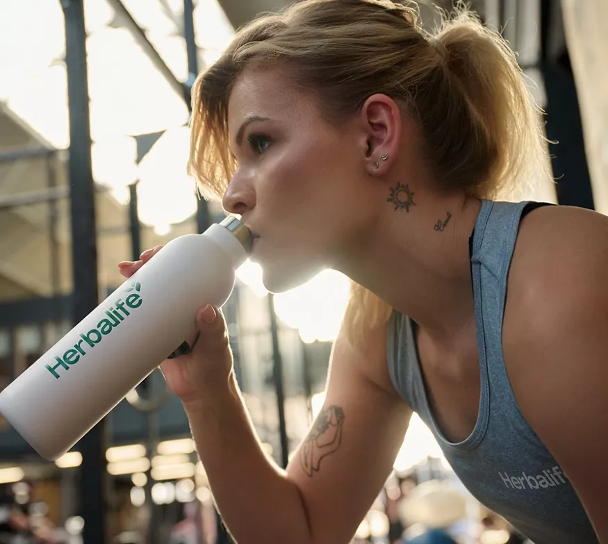 Woman staying hydrated during workout